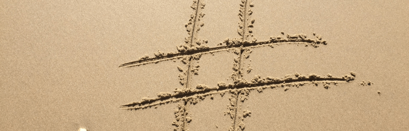 hashtag sign drawn in sand