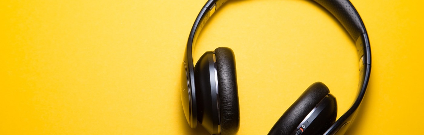 Black Headphones on yellow background